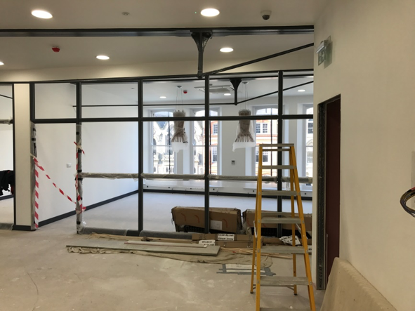Installation of power, intelligent lighting and data networking in this historic arcade building.